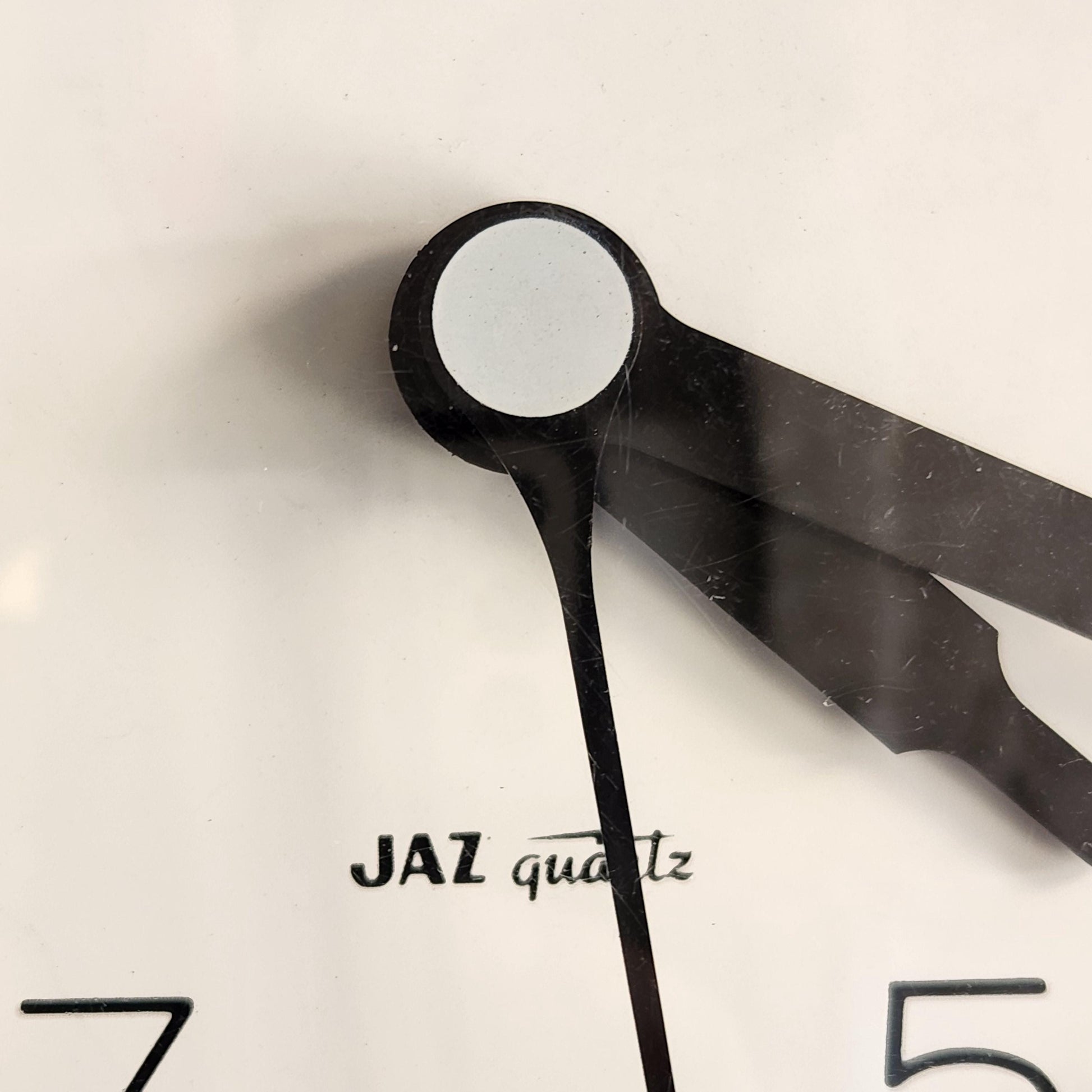 JAZ WALL CLOCK GREEN - Logo Closeup